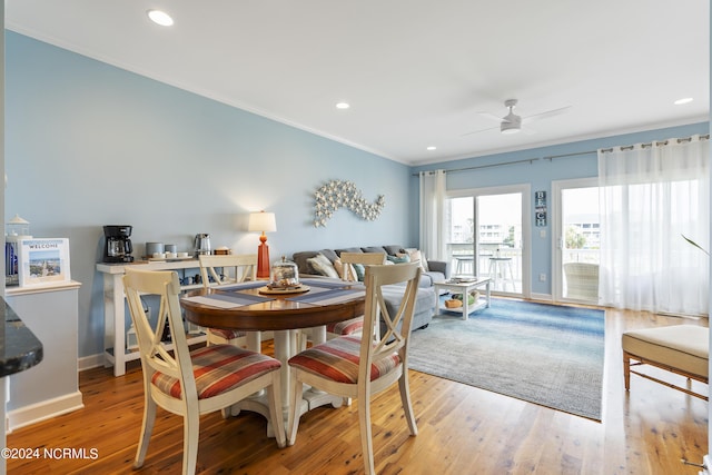 dining area featuring crown molding, hardwood / wood-style flooring, and ceiling fan