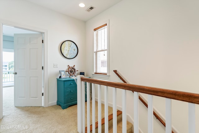 hallway with light carpet