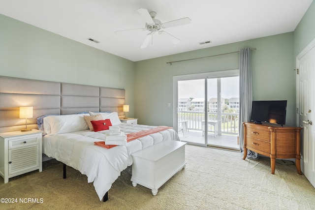 carpeted bedroom with ceiling fan and access to exterior