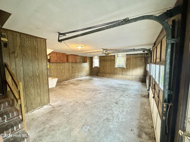 garage featuring wood walls