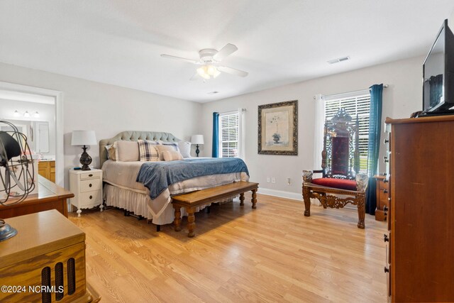 bedroom with ceiling fan and light hardwood / wood-style floors