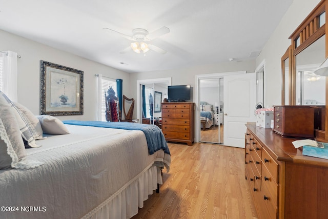 bedroom featuring light hardwood / wood-style flooring and ceiling fan