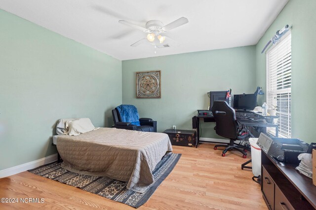 bedroom with light wood-type flooring and ceiling fan