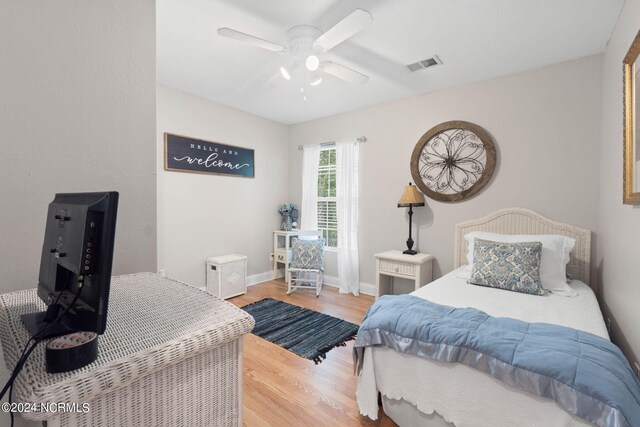 bedroom featuring light hardwood / wood-style flooring and ceiling fan