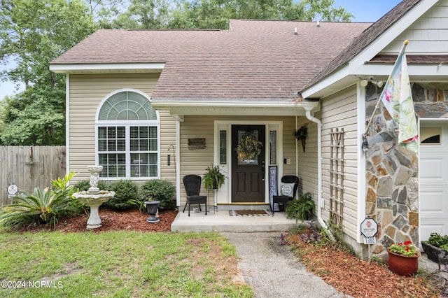 property entrance with covered porch