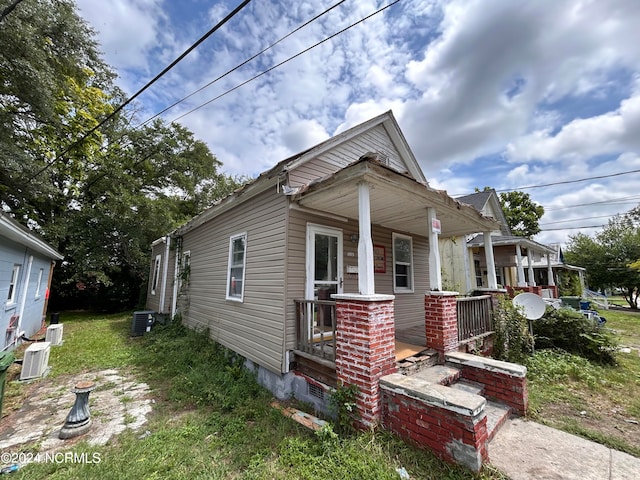 view of front of home featuring a porch and central AC