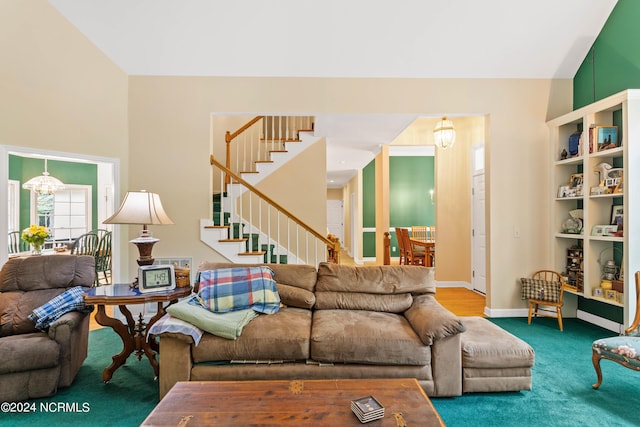 living room featuring an inviting chandelier and carpet floors