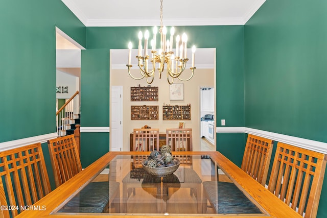 dining area with ornamental molding and a chandelier