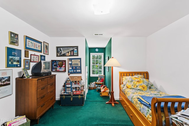 bedroom with dark colored carpet