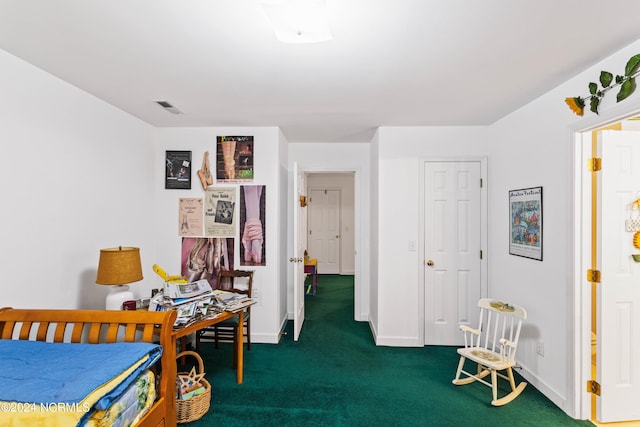 bedroom with dark colored carpet