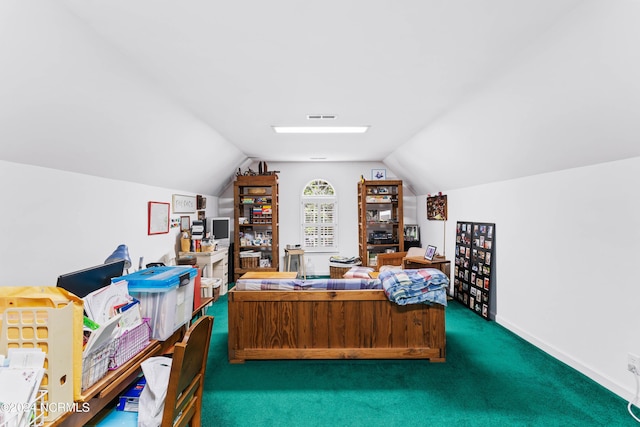 carpeted home office with vaulted ceiling