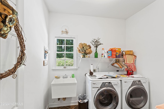 laundry area with sink, tile patterned floors, and washing machine and clothes dryer