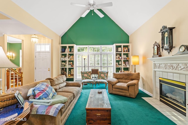 carpeted living room with ceiling fan, lofted ceiling, a fireplace, and a wealth of natural light