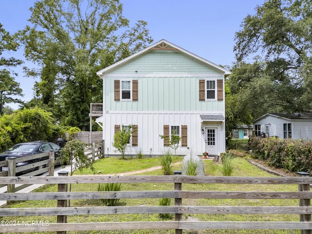 view of front of property with a balcony