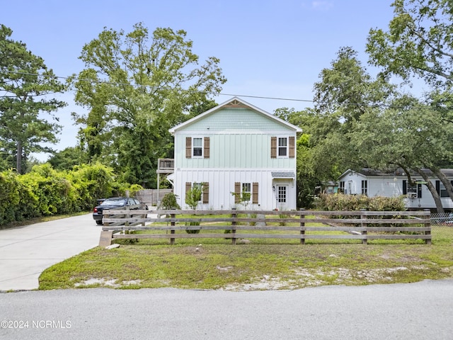 view of front of property with a balcony