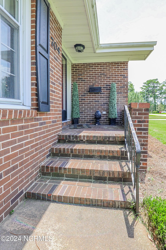 view of exterior entry with a porch