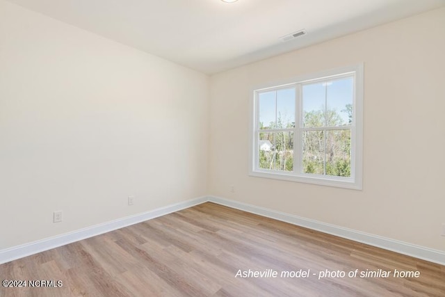 unfurnished room featuring light wood-type flooring