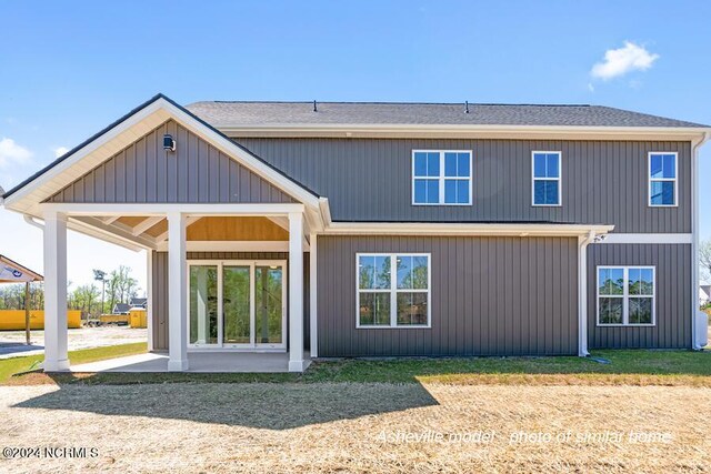 back of house with a patio