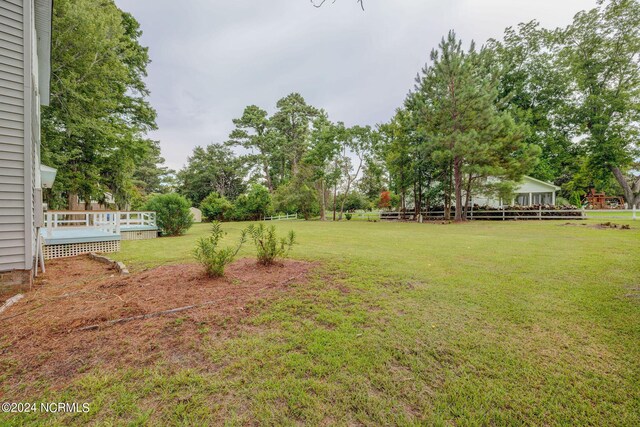 view of yard with a deck