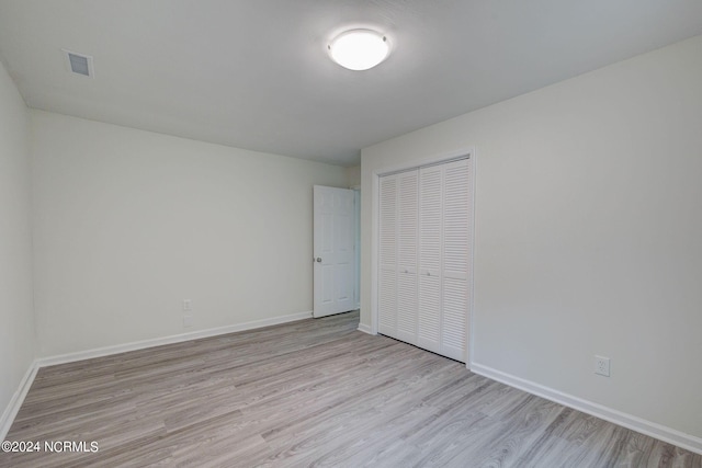 spare room with light wood-type flooring