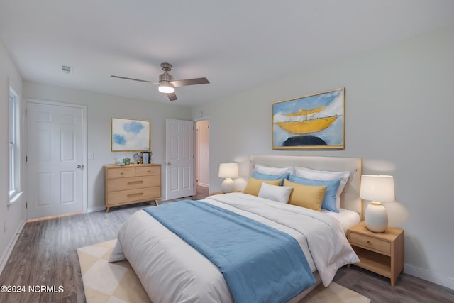 bedroom featuring hardwood / wood-style flooring and ceiling fan