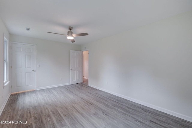 spare room with ceiling fan and light hardwood / wood-style flooring