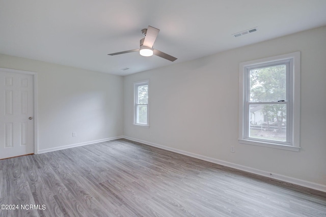 spare room featuring ceiling fan and light hardwood / wood-style flooring