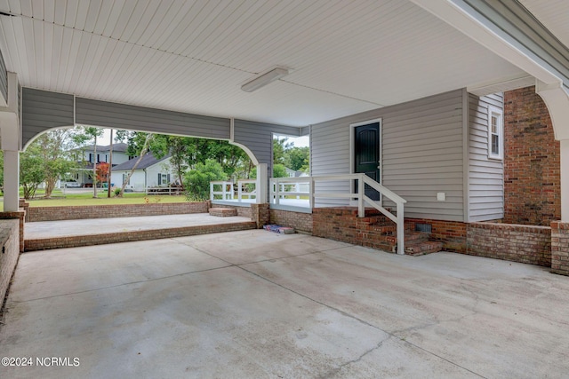 view of patio featuring a porch