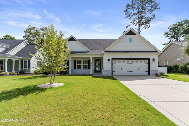 craftsman-style house with an attached garage, a shingled roof, a front lawn, and concrete driveway
