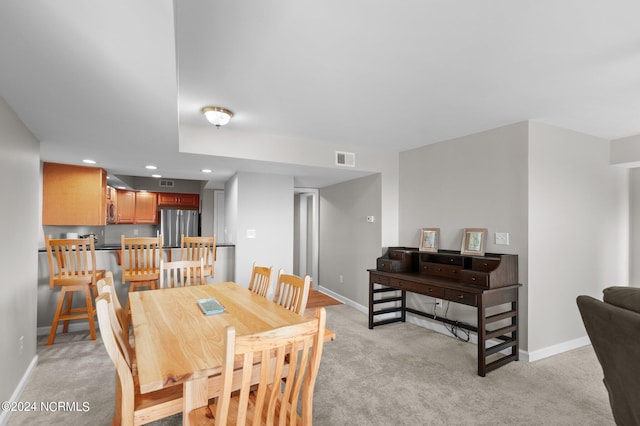 view of carpeted dining area