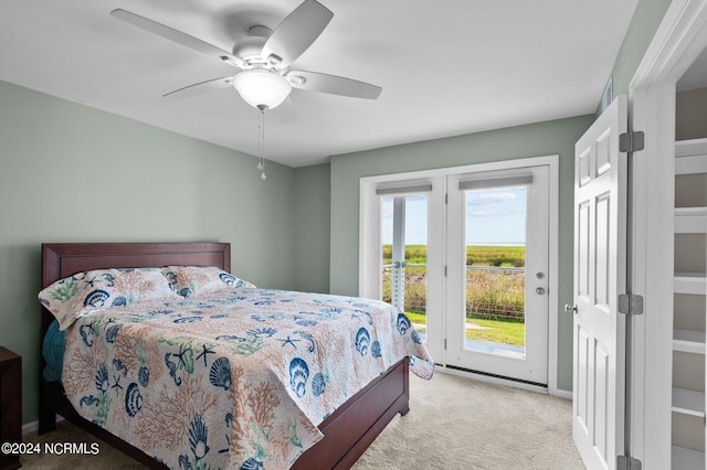 carpeted bedroom with access to exterior and ceiling fan