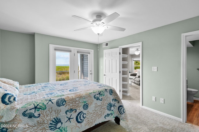 bedroom with connected bathroom, access to exterior, carpet floors, and ceiling fan