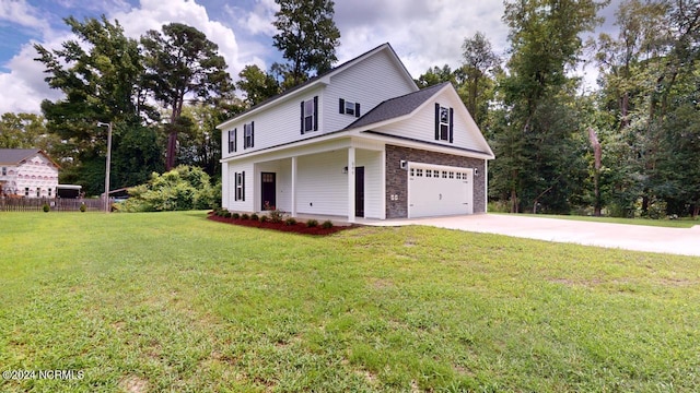 view of front of house with a garage, a porch, and a front lawn