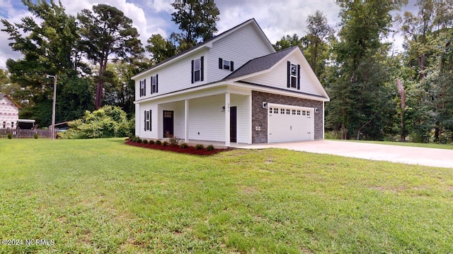 view of front of property featuring a garage and a front lawn