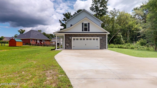 view of front of house featuring a garage and a front yard