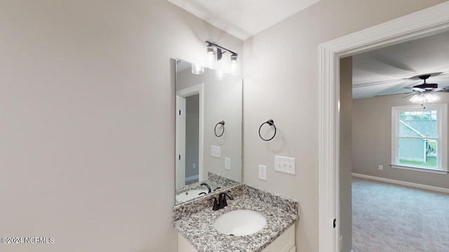 bathroom with ceiling fan and vanity