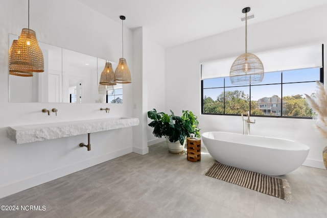 bathroom with a tub to relax in