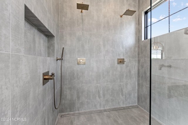 bathroom with a tile shower