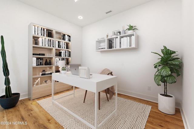 office space with hardwood / wood-style floors