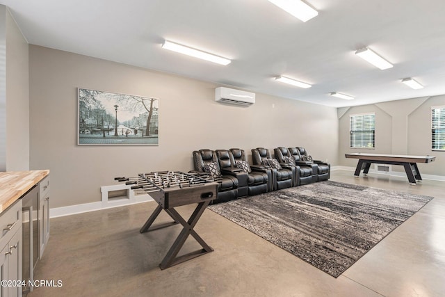 playroom with wine cooler, a wall mounted air conditioner, and concrete floors