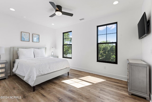 bedroom with dark wood-type flooring and ceiling fan