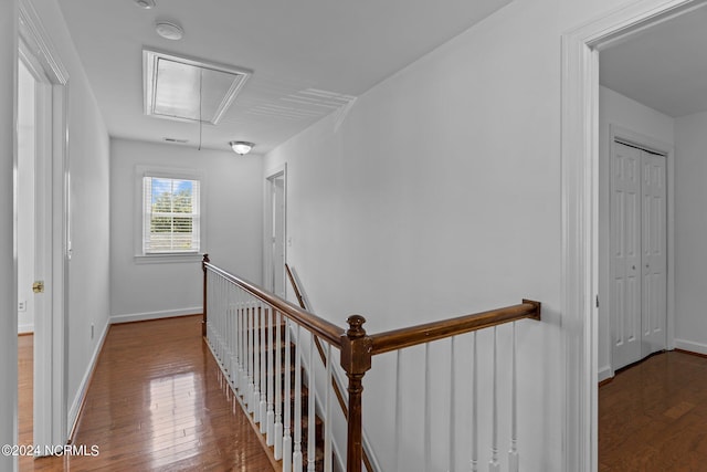 hall with wood-type flooring