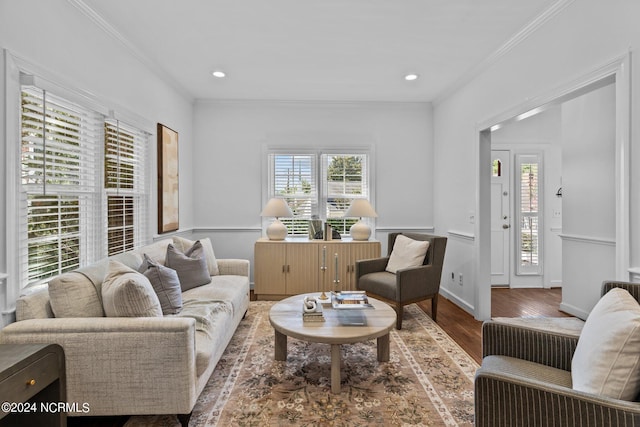 living room featuring hardwood / wood-style floors and crown molding