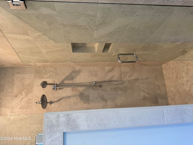 details featuring a tile shower