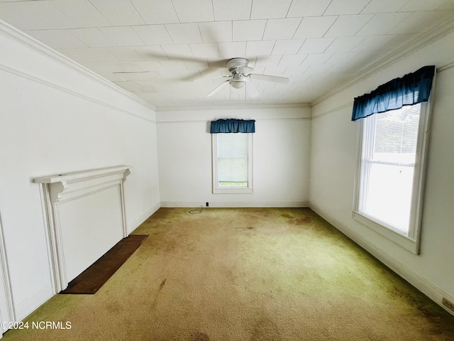 empty room featuring ceiling fan, light carpet, and plenty of natural light