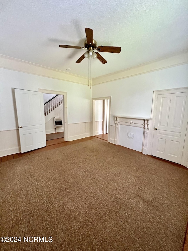 unfurnished bedroom featuring crown molding, a textured ceiling, carpet, and ceiling fan