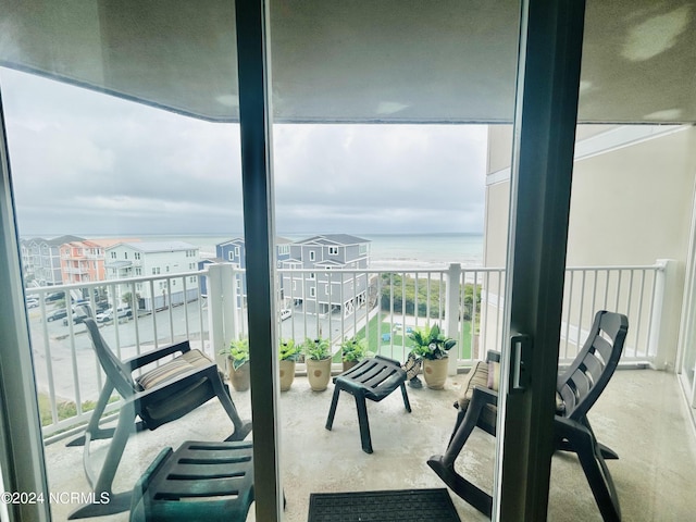 balcony with a water view and a residential view