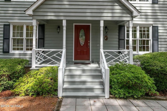 doorway to property featuring covered porch