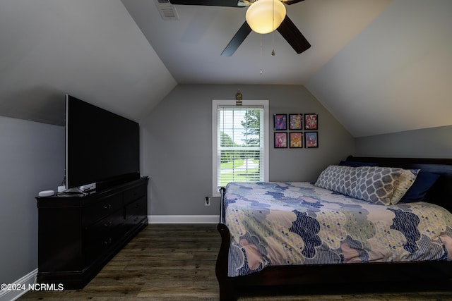 bedroom with ceiling fan, dark hardwood / wood-style flooring, and vaulted ceiling