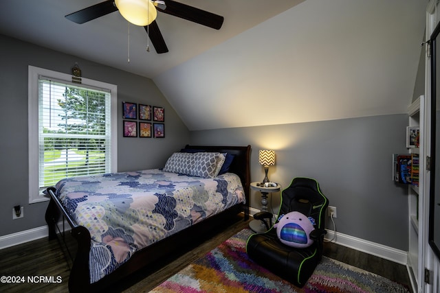 bedroom featuring ceiling fan, dark wood-type flooring, and vaulted ceiling